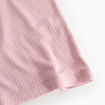 Pink ribbed hem and cuffs on long-sleeve T‑shirt