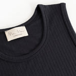 Sort tank top with round neckline and visible label at the collar.