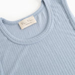 Light blue tank top with crew neckline, visible brand label, and rib pattern.