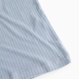 Light blue ribbed tank top, detailed edge and seam at the bottom.