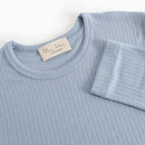 Light blue evening dress with round neckline, ribbed fabric and cuffed sleeves.