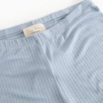 Light blue pants with elastic waistband and internal label.