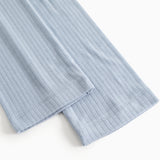 Light blue trousers with ribbed pattern and lower seam.