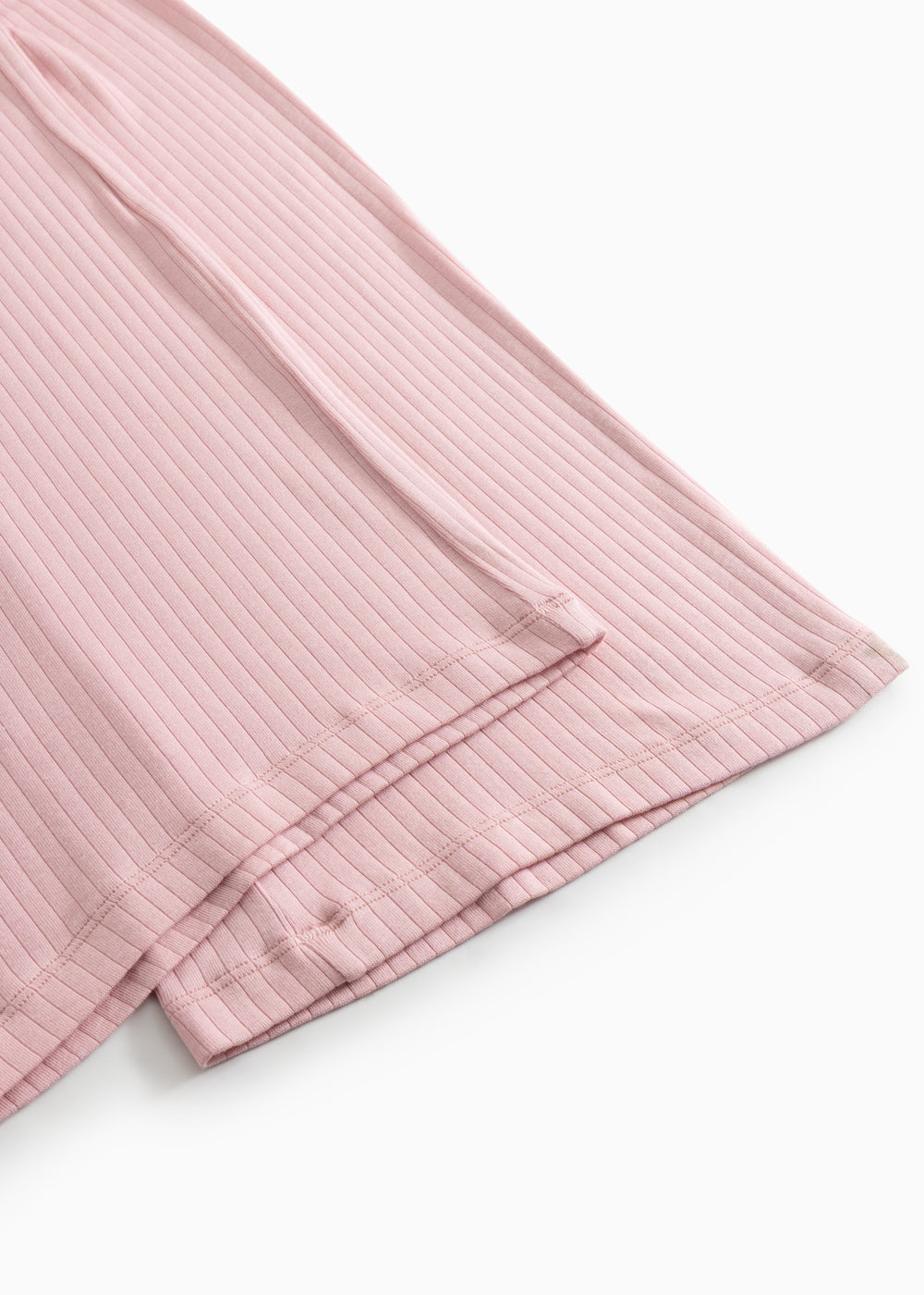 Pink cotton pants with ribbed fabric and double-stitched hem.