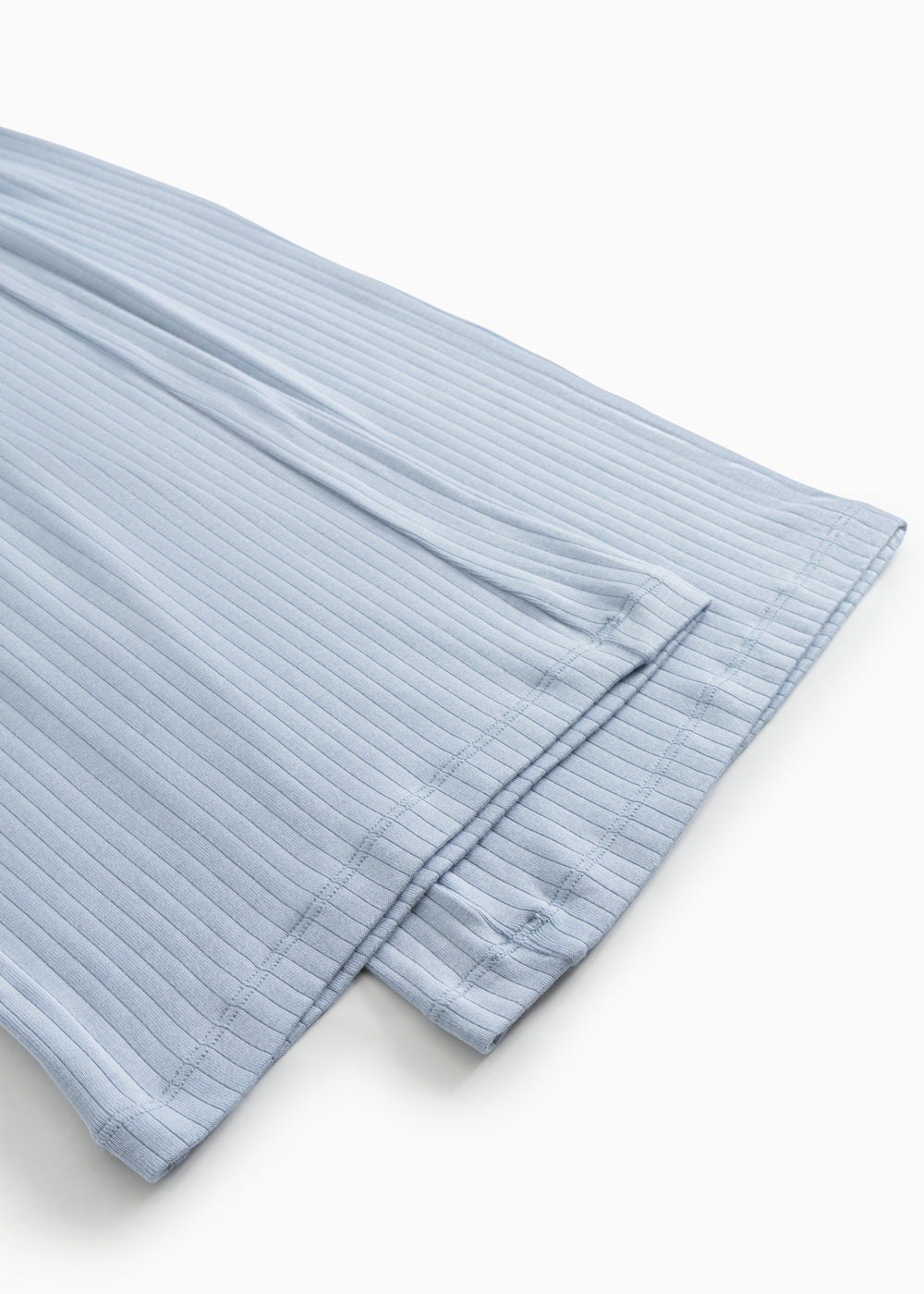Light blue trousers with stitching at the leg opening and a slight crease.