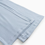 Light blue trousers with stitching at the leg opening and a slight crease.