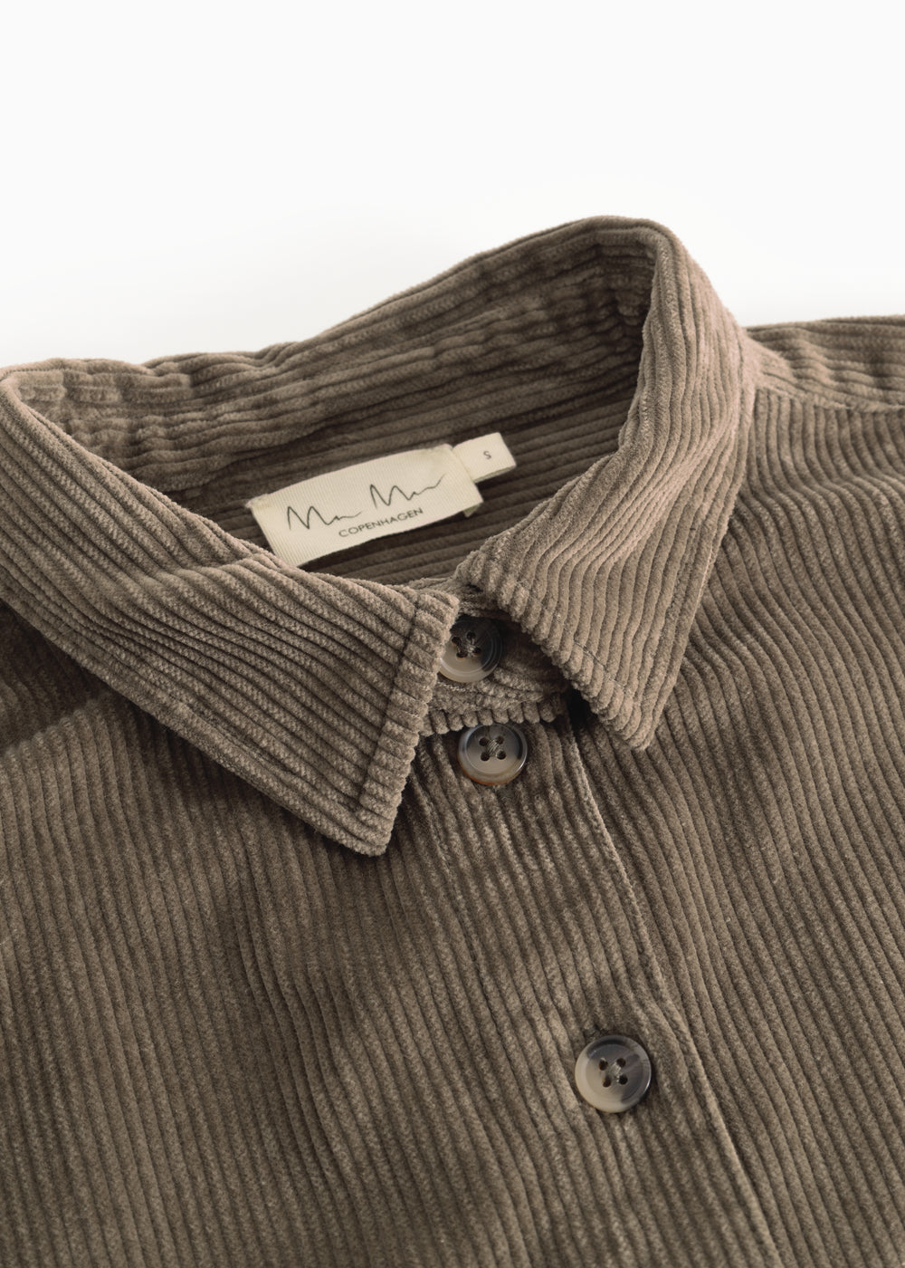 Dark olive shirt collar with buttons and light rib texture.