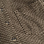 Dark olive shirt with chest pocket, buttons and ribbed pattern