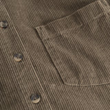 Dark olive shirt with chest pocket, buttons and ribbed pattern