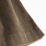 Brown lower part with ribbed edge and diagonal seam details at the bottom.