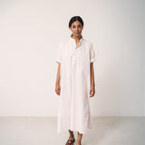 Woman wearing a bright red dress with a loose fit