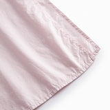 Red dress with short sleeves and a button-up closure.