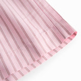 Red shorts for women with fine stripes, side pockets, and elastic at the waist.