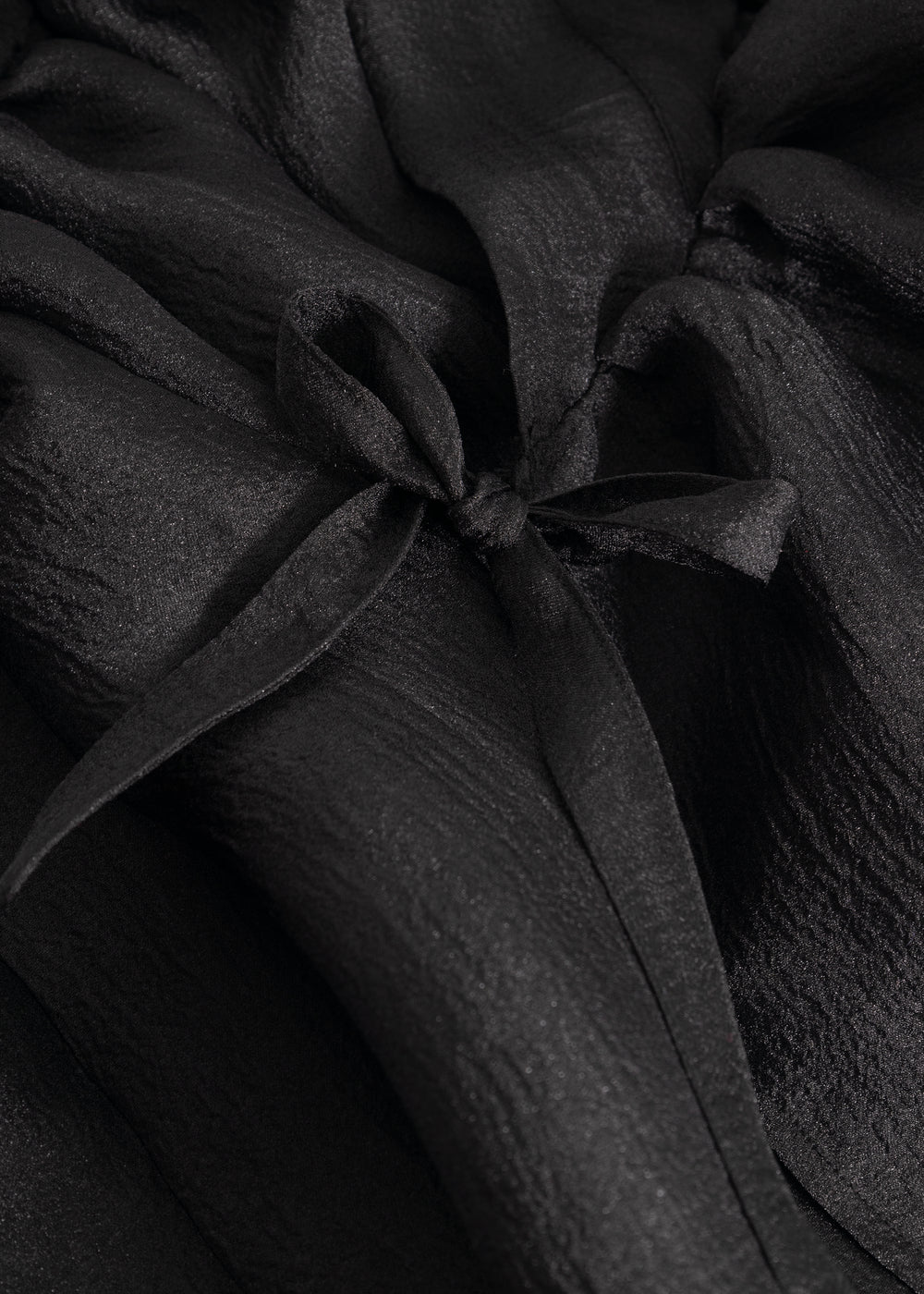 Black dress with bow detail at the neckline and gathered bodice