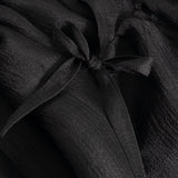 Black dress with bow detail at the neckline and gathered bodice
