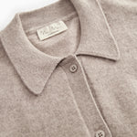 Details of the gray melange cardigan: collar, buttons, and inner label