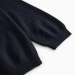 Dark indigo Kashmir cardigan with soft ribbed cuff detail.