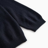 Dark indigo Kashmir cardigan with soft ribbed cuff detail.