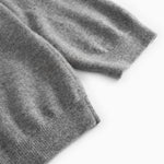 Gray blend knitted sleeve edge with ribbing on a Kashmir polo.