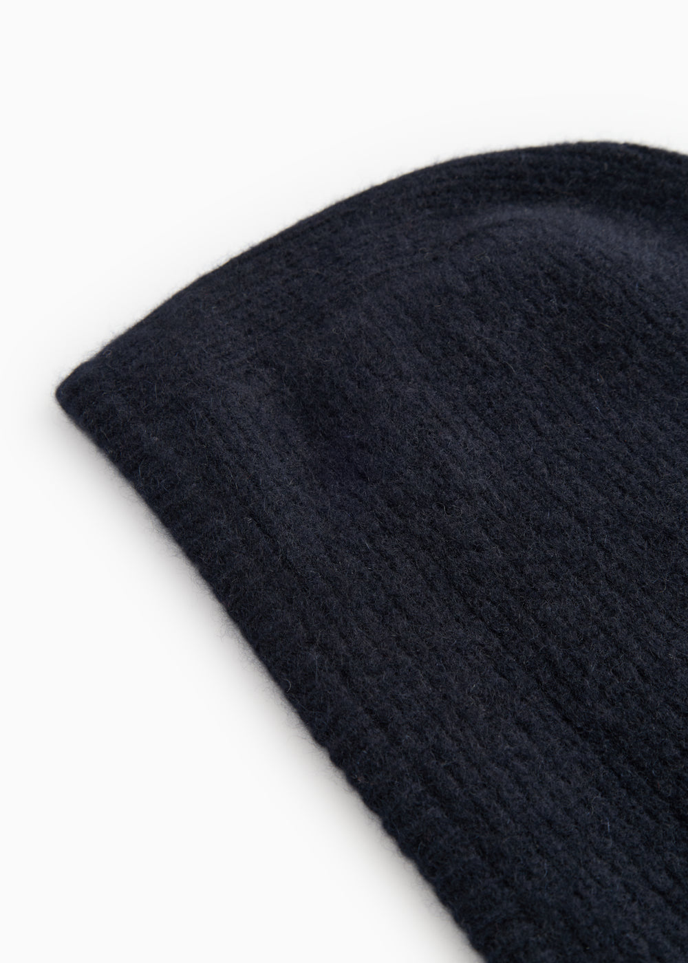 Kashmir hue in dark indigo with a tightly knitted texture and a slanted edge