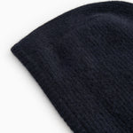 Kashmir hue in dark indigo with a tightly knitted texture and a slanted edge