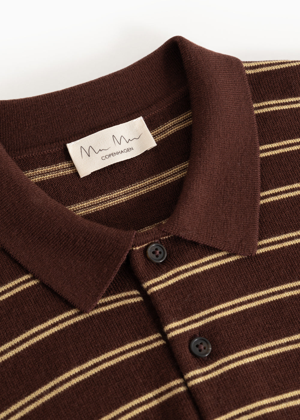 Black striped polo shirt with collar and button closure, plus ribbed trim at the neckline.