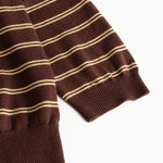 Dark striped polo shirt with ribbed edge at the sleeve end and bottom edge