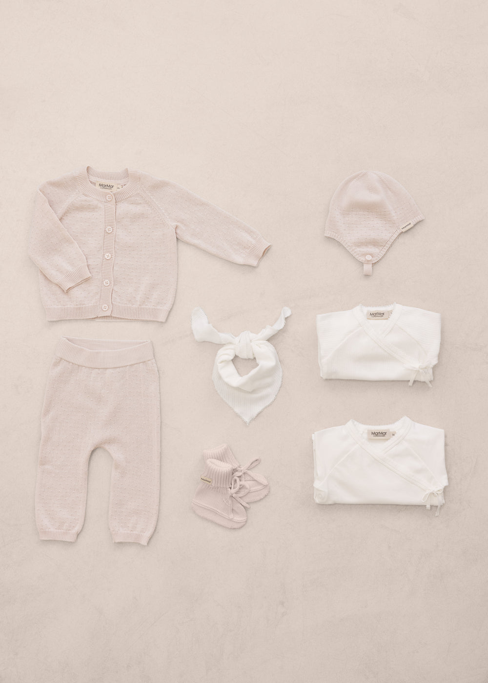 Red baby set with striped sweater, pants, body, and accessories