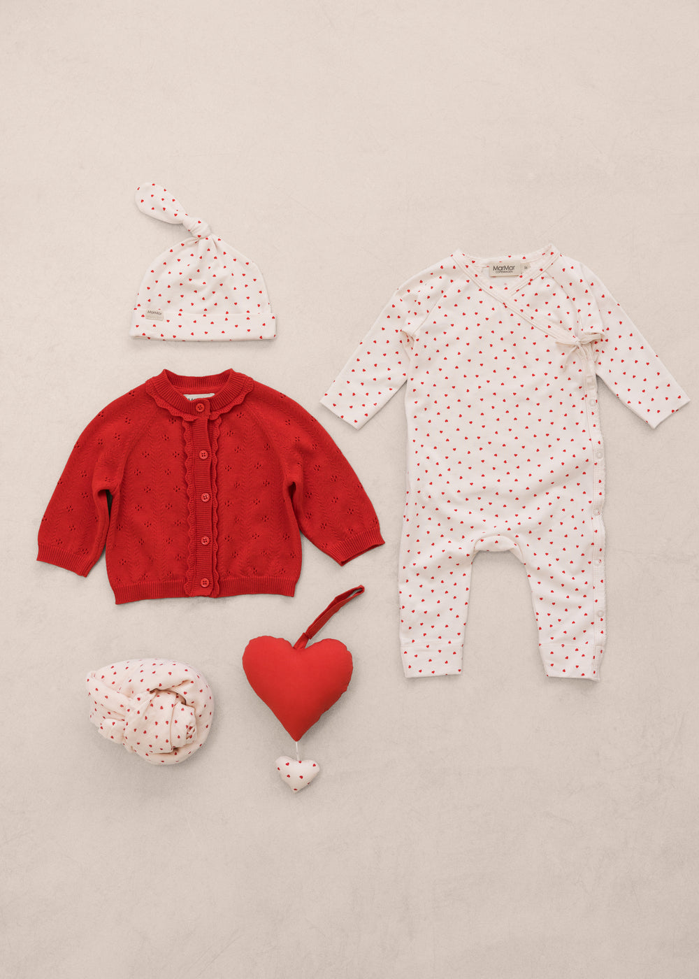 Baby sets with clothing, accessories, and red music.